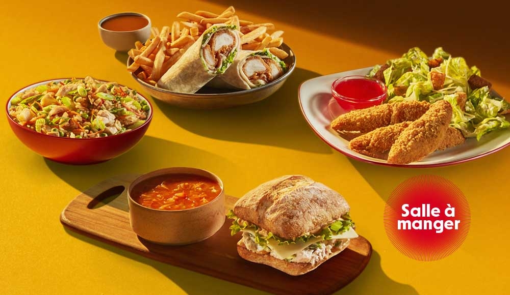 4 repas du midi sur une table dans un restaurant St-Hubert 